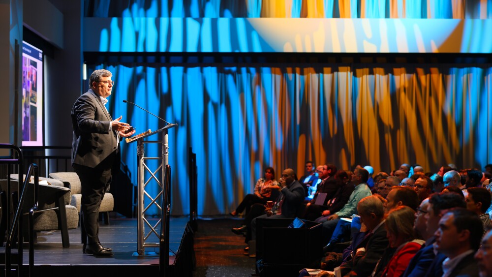 Image of Jorij Abraham, Managing Director at the Global Anti-Scam Alliance, giving a presentation on “The Global State of Scams in 2024” to summit attendees.