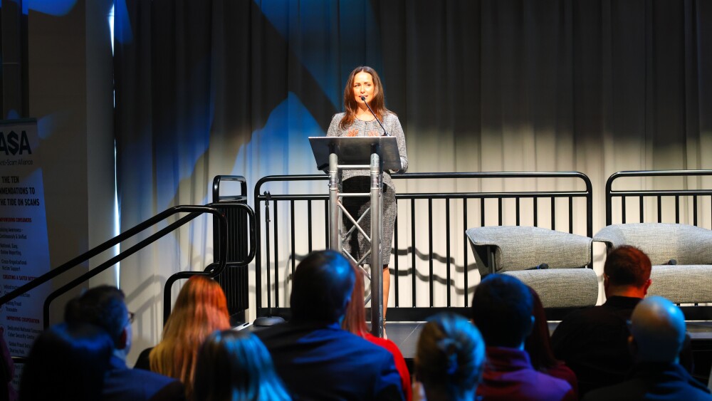 Image of Head of External Relations for Customer Experience Integrity at Amazon, Abigail Bishop, speaking to summit attendees.