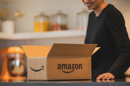 Person opening a package at a table