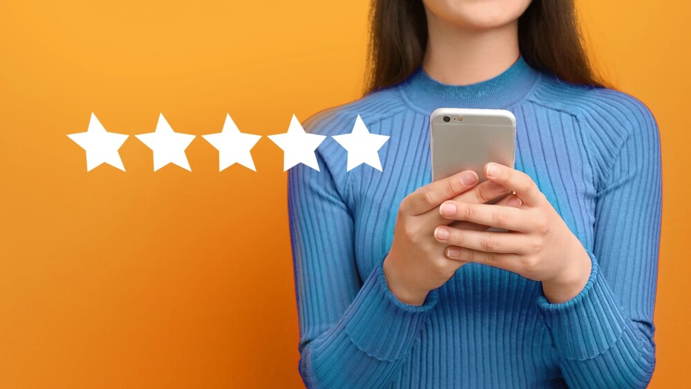 Illustration of a customer looking at user reviews on mobile device to showcase trustworthy reviews concept